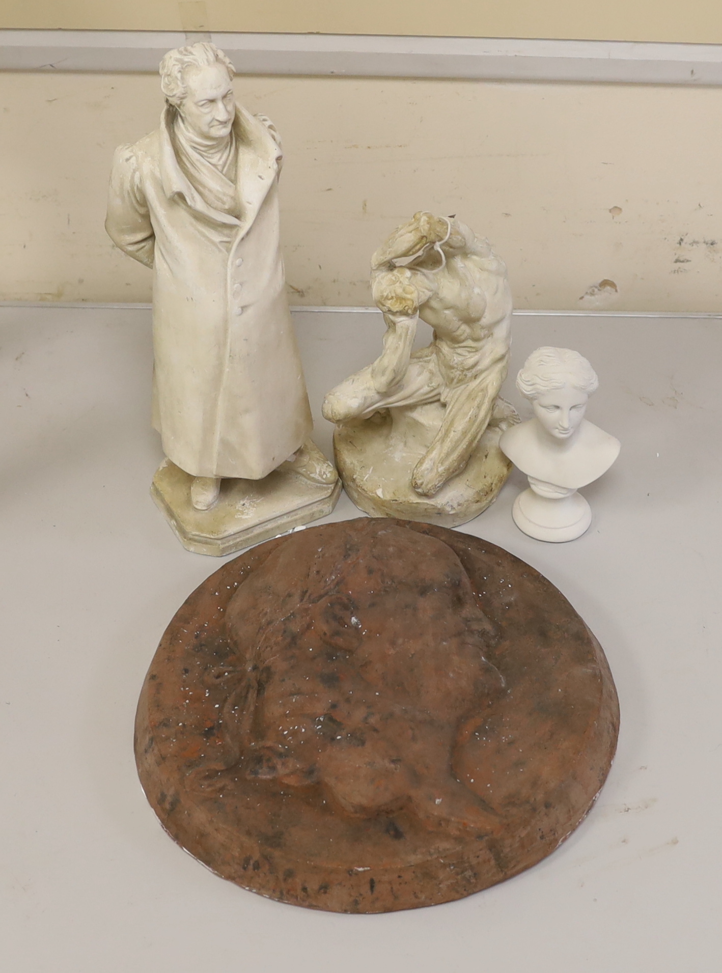 A plaster echore model, 20cm high, and three other items to include a bust of a lady